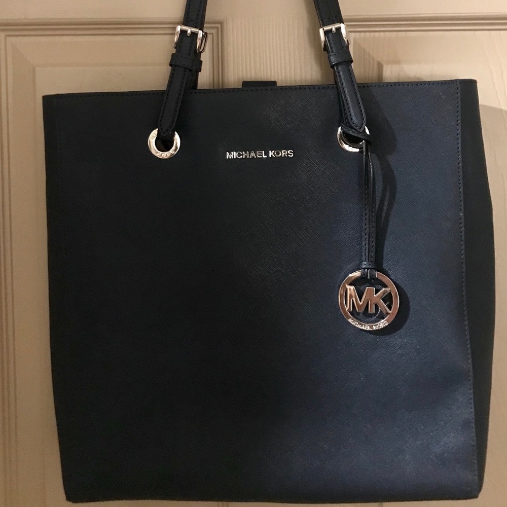 Navy Blue Saffiano leather w/silver accoutrements.